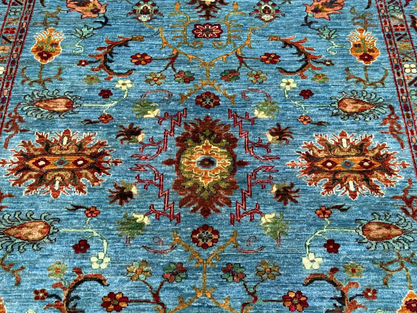 Close-up floral pattern of 5x7 Sultani wool oriental rug
