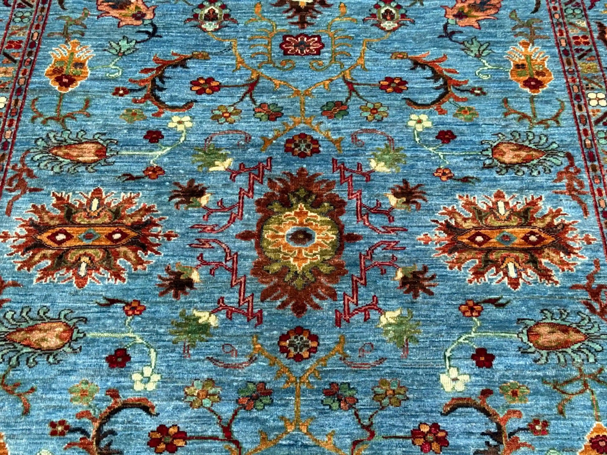 Close-up floral pattern of 5x7 Sultani wool oriental rug