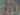 Close-up of geometric Mamluk rug pattern in turquoise, red, and green