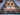 Red and green tribal Kilim area rug used in home decor setup.