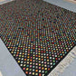 Colorful Turkish Kilim rug styled in boho-themed interior – modern wool flatweave.