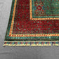 Corner detail of 6x8 red and teal Mamluk wool rug with geometric design