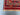 Corner detail of hand-knotted Afghan Mushwani rug with red and navy tones