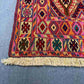 Corner detailing of handwoven antique kilim with geometric motif