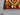 Detailed view of corner weave on red & green Kilim runner rug