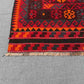 Corner detail of red and black geometric Kilim rug – traditional Turkish hand-knotted wool flatweave.