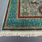Detailed corner of hand-knotted Mamluk Oriental rug – turquoise and green wool silk