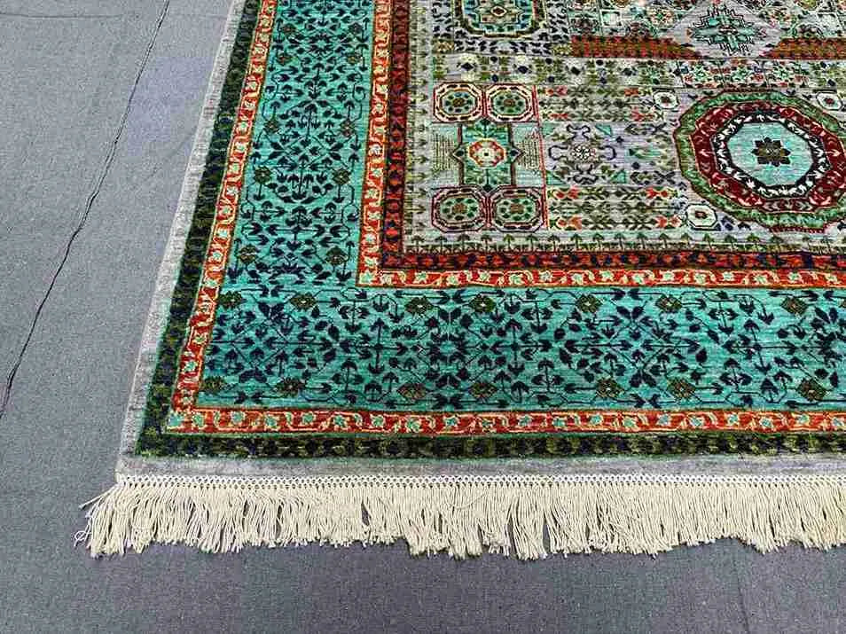 Detailed corner of hand-knotted Mamluk Oriental rug – turquoise and green wool silk