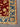 Corner detailing of red Persian-style floral wool rug