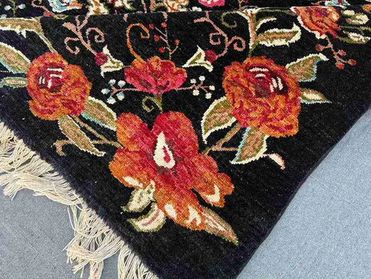 Corner detail showing fine wool flatweave and traditional floral pattern