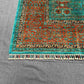 Corner pattern detail of handmade 6x8 green and orange Mamluk rug