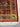 Corner close-up of 4x6 Persian area rug with gold floral design