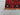 Corner detail of Turkish Kilim rug – handwoven red and black wool flatweave with tribal design.