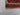 Corner detail of vintage Afghan Kilim rug – small red wool flatweave with knotted tribal accents.