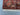 Corner detail of Sultani Persian rug – burgundy and multi-color design