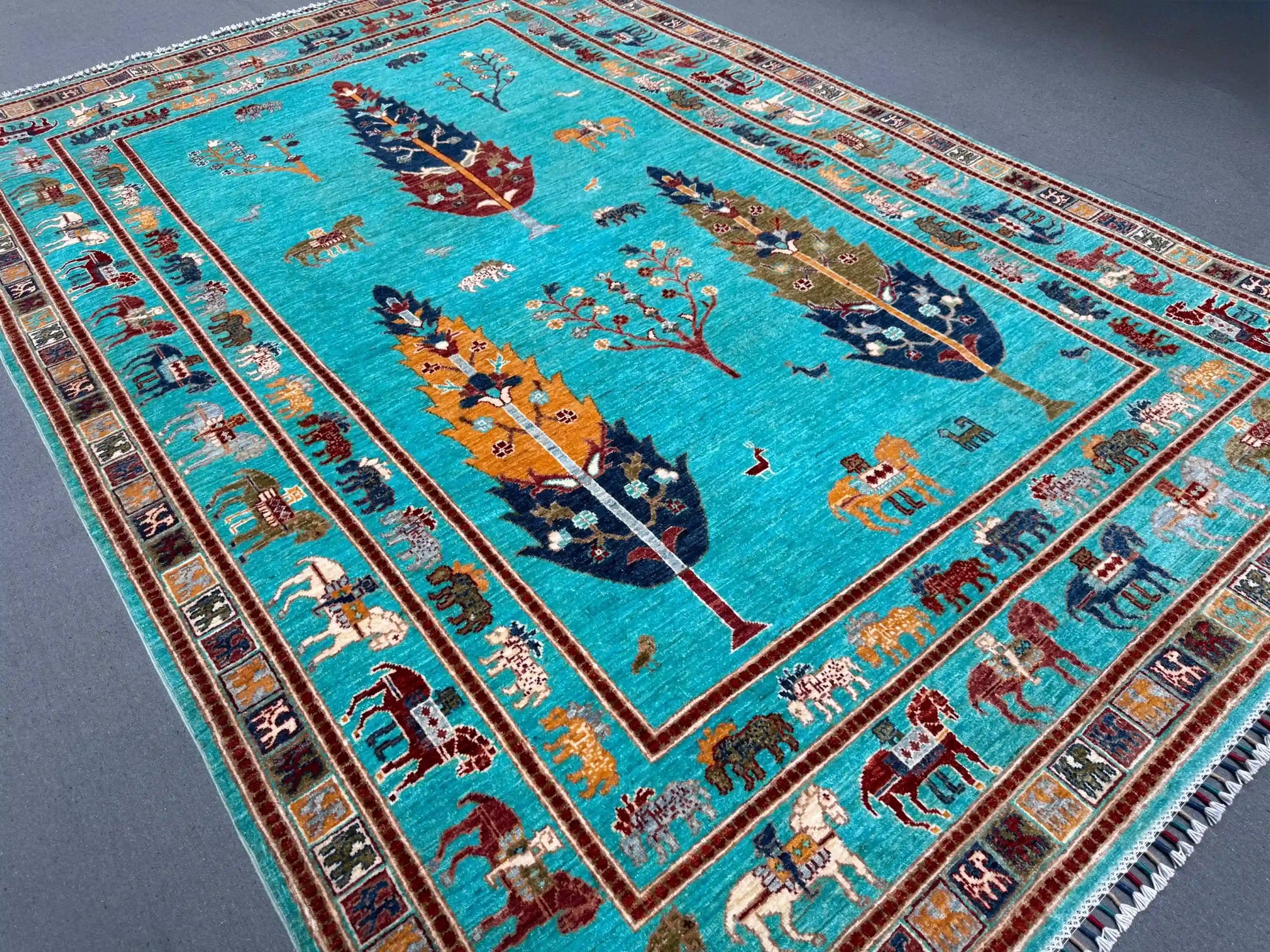 Corner view of Tree of Life rug on wooden floor