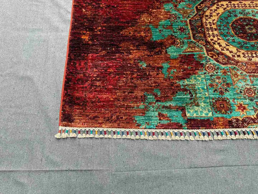 Corner view showing texture and design of modern wool and silk rug