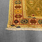Corner weave detail of gold-accented Afghan tribal kilim rug