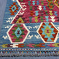 Corner detailing of Turkish flatweave Kilim with vibrant tribal patterns.