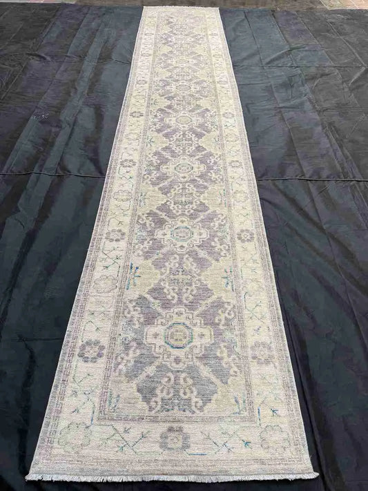 Soft pastel blue and cream runner styled in entryway