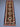 Bohemian-style Kilim runner rug on wooden floor – geometric pattern