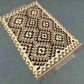 Floor view of earthy-tone flatweave Kilim rug – boho tribal wool carpet.