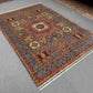 Room setting view of earthy toned Mamluk rug – luxury wool silk carpet