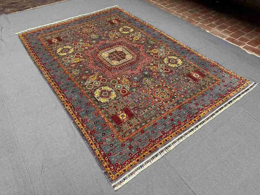 Room setting view of earthy toned Mamluk rug – luxury wool silk carpet