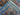 Edge fold of handmade blue Bakhtiari rug displaying knotted construction