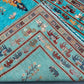 Edge fold detail of Tree of Life handmade turquoise wool rug