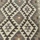 Close-up texture of handmade flatweave Kilim runner – durable wool weave.