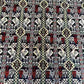 Close-up of floral and geometric patterns on Persian-style handmade rug