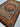 Handmade oriental silk rug with medallion design on wooden flooring