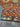 Folded 8x11 Khorjin Kilim rug – vibrant multicolor wool flatweave with tribal design.