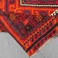 Folded view of 8x12 Turkish Kilim rug – vintage red and black tribal wool flatweave.