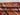 Folded corner view showing stripe design on Art Deco rug
