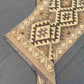 Folded view of flatweave Kilim runner rug in beige and brown – easy to store and reversible.