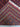  Folded view of hand-knotted red and blue wool Oriental rug