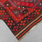 Folded 8x12 vintage Turkish Kilim rug – red and black wool flatweave with tribal oriental design.