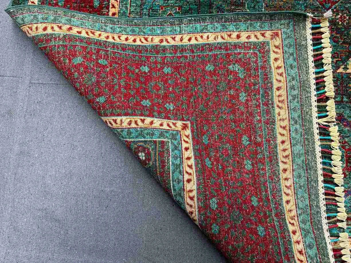 Folded view of 6x8 Oriental Mamluk rug showing weave and texture