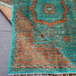 Folded handmade 6x8 Mamluk rug showing vibrant colors and texture