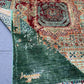 Folded view of modern abstract Mamluk rug showing texture