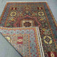 Folded view of handmade Turkish Mamluk rug showing side texture
