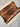 Folded silk Persian wall rug showing backside and texture