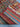 Folded view of knotted multicolor Afghan rug