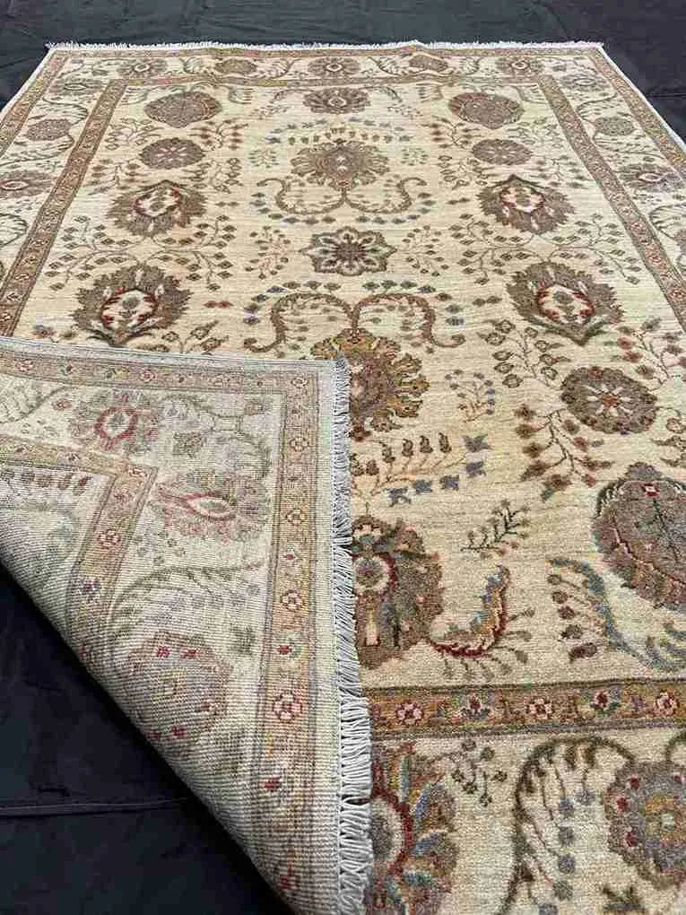 Knotted beige Persian Chobi rug 5x7 ft folded – wool craftsmanship.