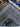 Folded Persian-style blue and red wool silk rug showing hand-knotted texture