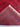 Folded view of soft handmade wool silk red Oriental rug