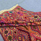 Side view of folded Turkish handmade kilim rug showing thickness