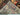 Side view of folded antique Baluchi rug showing handwoven wool edges and depth
